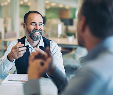 Smiling mature businessman in a meeting